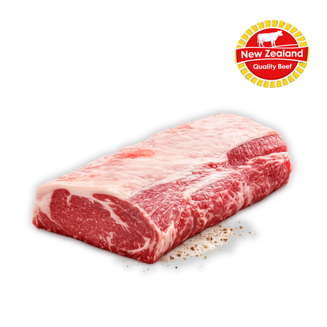 Block of raw beef with New Zealand Quality Beef logo on a white background