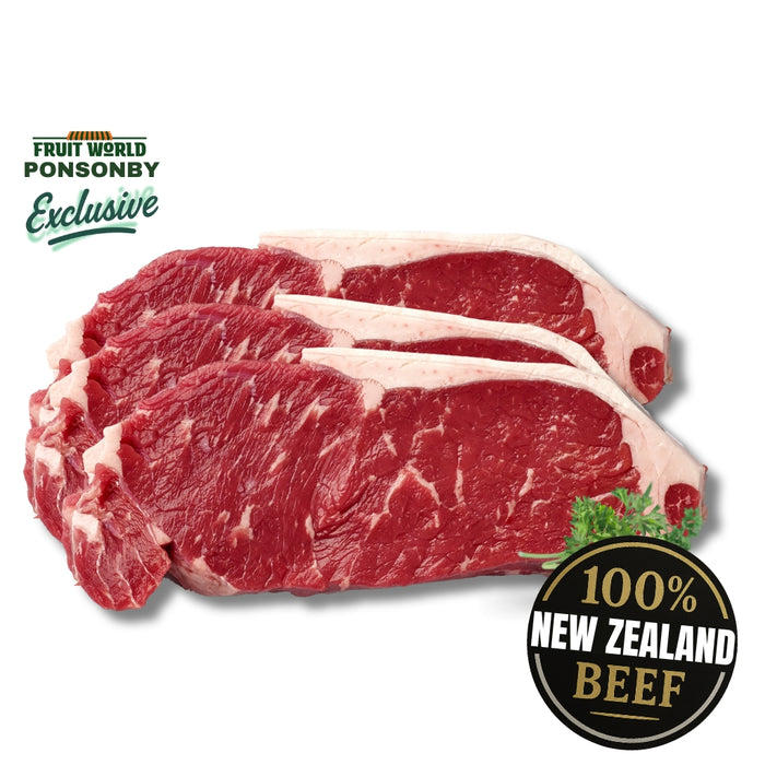 Three raw beef steaks with '100% New Zealand Beef' label on a white background